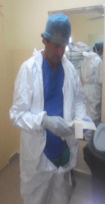 Gerard puttting on PPE_355x690